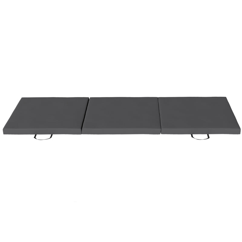 Grey tri-fold gymnastics crash mat with three hinged sections and end handles