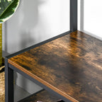 Rustic brown wooden bench top with black metal frame corner