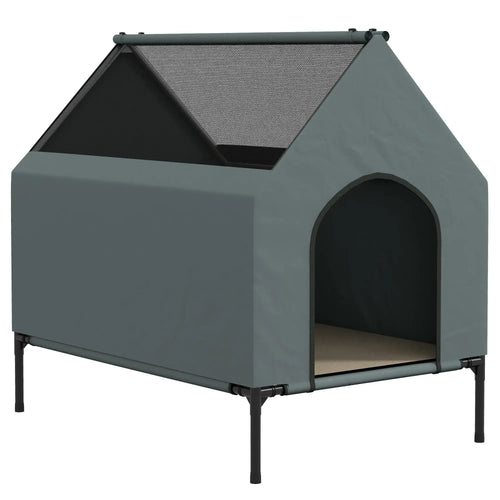 Grey elevated dog house with sloped roof cover and arched front entry opening.