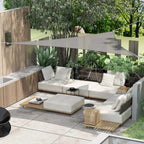 Grey triangle shade sail stretched over outdoor seating area with corner attachment ropes