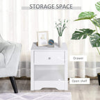 White nightstand with drawer and open shelf, styled in a bedroom setting.