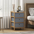 Compact light grey fabric drawer dresser with bamboo frame and three round pull handles
