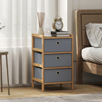 Compact light grey fabric drawer dresser with bamboo frame and three round pull handles