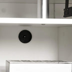White desk base with round cable grommet for passing cords neatly