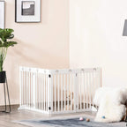 White foldable wooden pet gate set up with vertical slat panels and paw cutouts