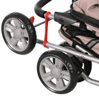 Wheel and silver frame detail of brown pet stroller with red connector accents