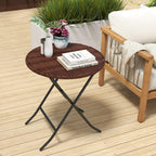 Foldable round rattan side table with brown tabletop and black folding legs