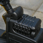 Black plastic engine-style panel detail on the ride-on construction tractor