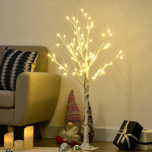 Artificial white birch tree with warm white LED lights next to living room decor