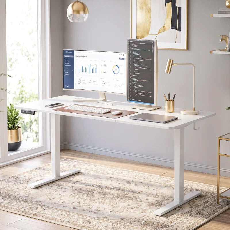 White adjustable standing desk with computer setup and open underside clearance