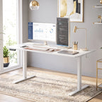 White adjustable standing desk with computer setup and open underside clearance