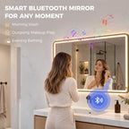 Gold-tone LED bathroom mirror with glowing rectangular frame over the sink area.