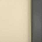 Close-up cream retractable screen fabric with gray edge housing