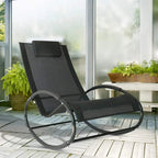 Black rocking patio lounge recliner with padded headrest and mesh seat