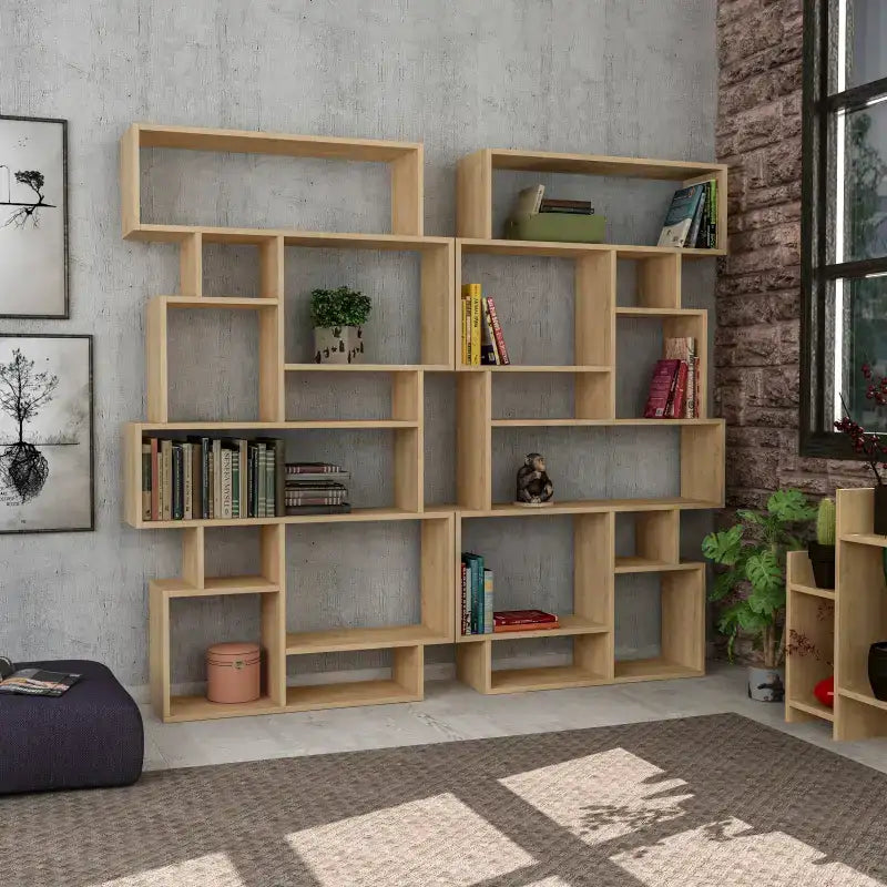 Tall modern bookcase with open cubby shelves, light oak finish, arranged for books and decor