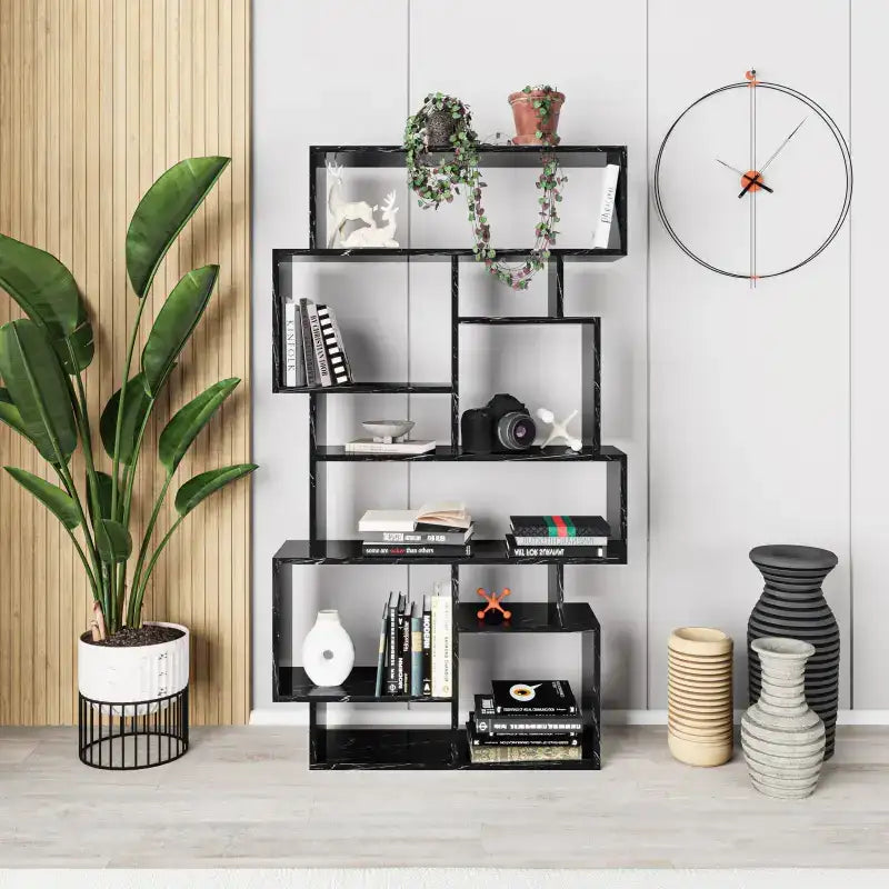 Tall bookcase display unit with black shelves and open compartments for books and decor