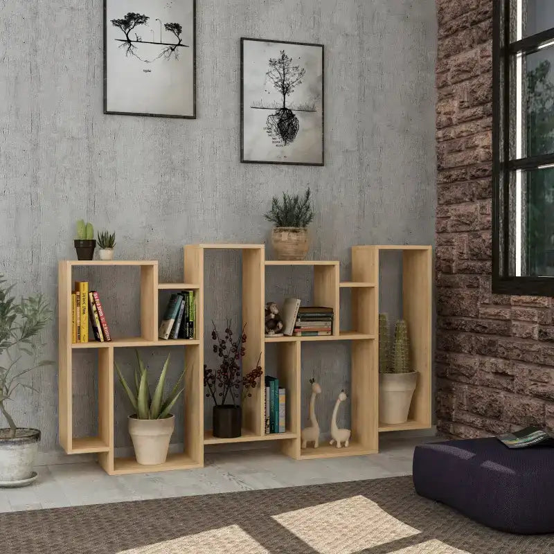 Tall modern bookcase with open cubby shelves, light oak finish, shown against wall