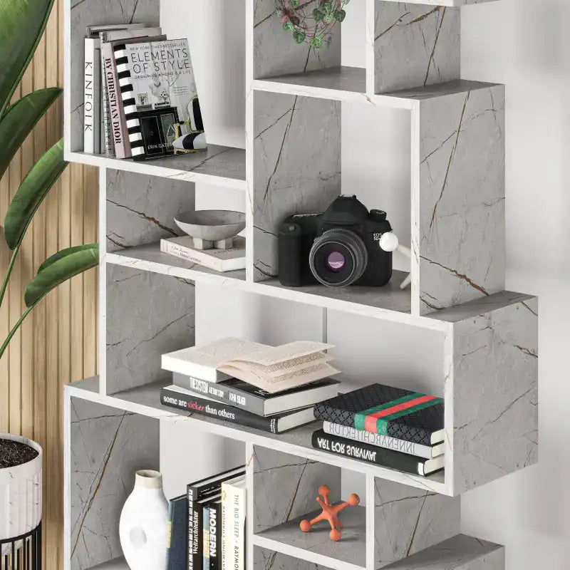 Tall bookcase display unit with white marble-look panels and open cubby compartments