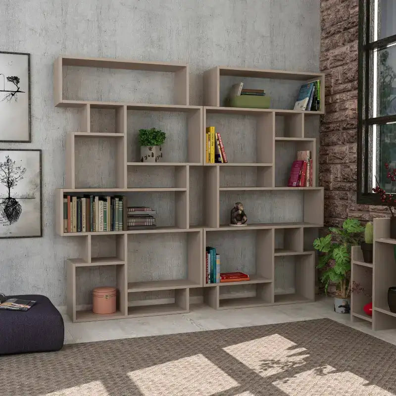 Tall bookcase display unit with light grey shelves and many open square compartments