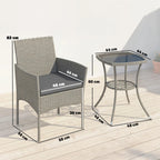 Two-tier glass-top bistro table beside dark grey rattan armchair with seat cushion