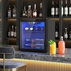 Black tabletop wine cooler with blue-lit glass door for storing bottles on racks.
