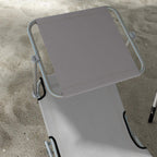 Light grey foldable sun lounger seat and back with metal frame handle