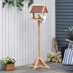 Garden freestanding wooden bird feeder table with roof and perching birds