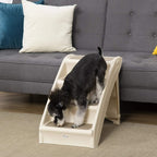 Beige four-step pet stairs with dark gray treads; small dog standing on top step