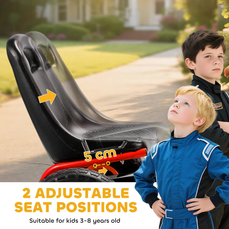 Adjustable black seat on red kids pedal go-kart with orange wheels.