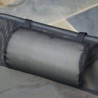 Black removable padded headrest on mesh sun lounger, close-up