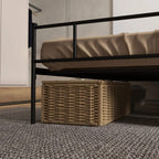 Black metal bed frame with headboard and slatted base, storage area under bed