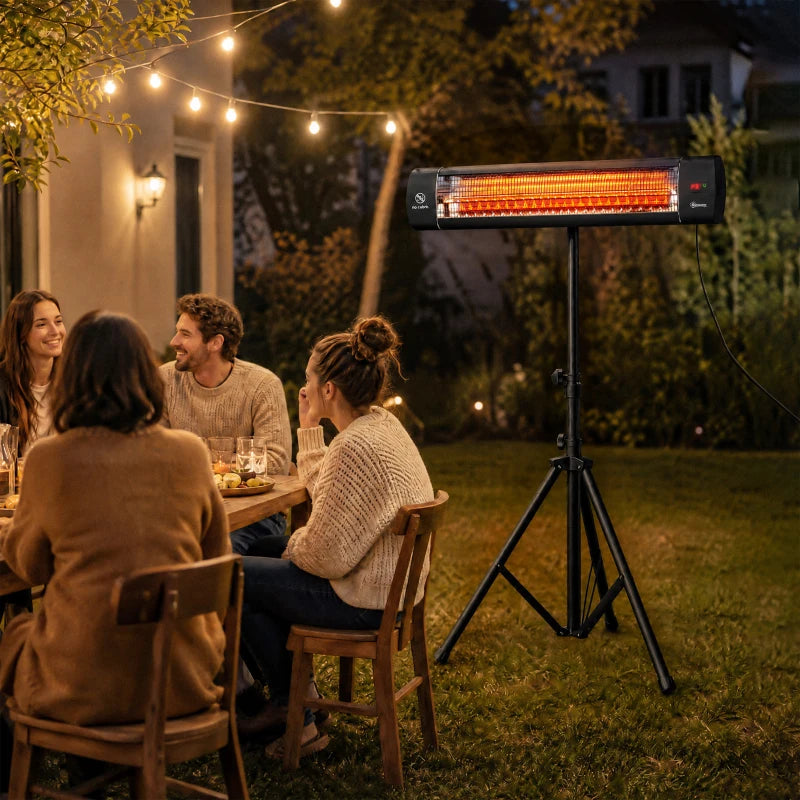 Black infrared patio heater on tripod at an outdoor seating gathering