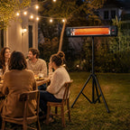 Black infrared patio heater on tripod at an outdoor seating gathering