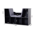 Black cube storage shelf with gray cushioned reading seat and open cubbies