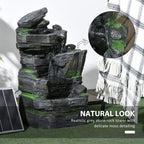 Dark grey rock water fountain with green moss detailing