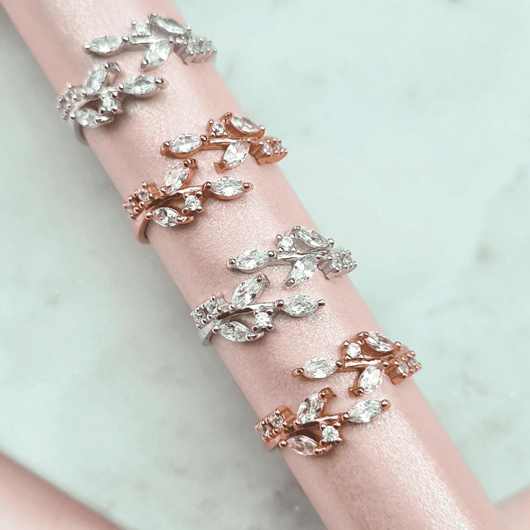 Adjustable sterling silver leaf ring with prong-set marquise-cut stones, side view