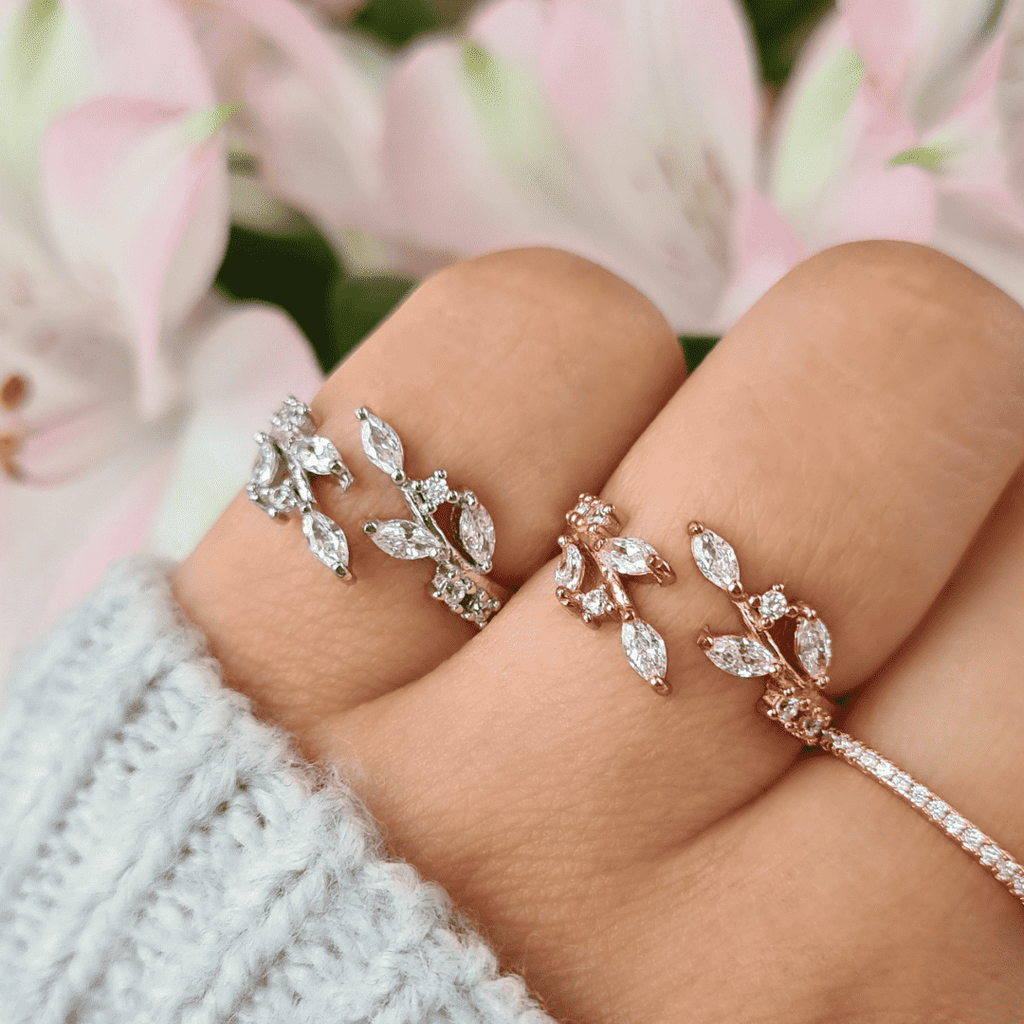 Sterling silver adjustable leaf cluster ring with marquise-cut stones on hand
