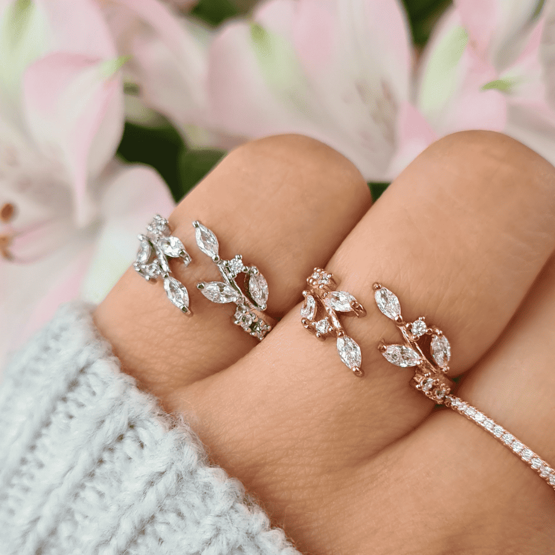 Sterling silver adjustable leaf cluster ring with marquise-cut stones on hand