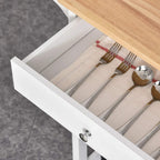White pull-out drawer on a kitchen trolley with cutlery neatly arranged inside