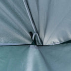 Close-up of umbrella side panel corner with tie strap and metal pole fastener