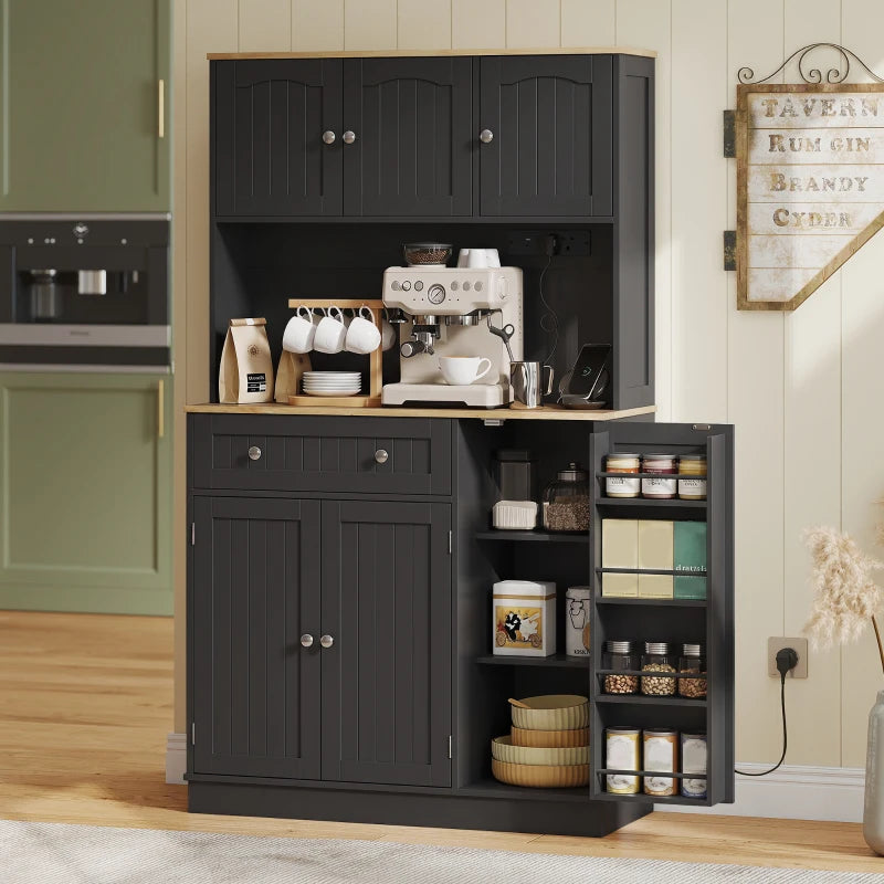 Black kitchen cupboard with open spice racks and storage shelves on the right side