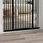Black pressure-fit dog safety gate bottom rail with vertical bars at doorway threshold