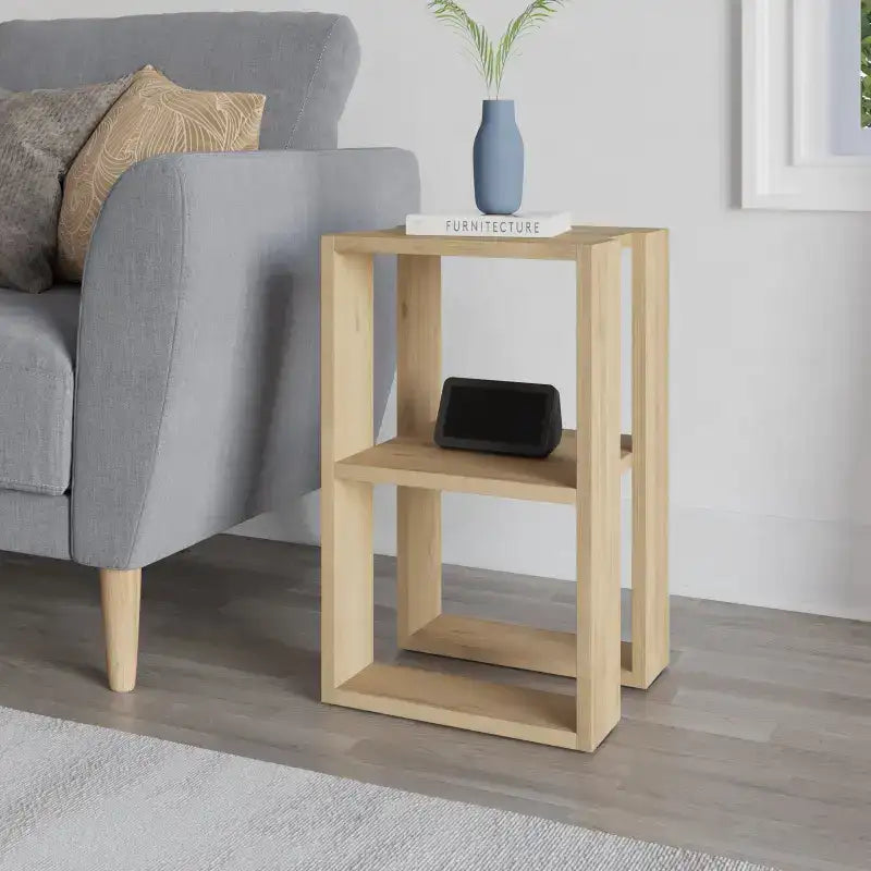 Modern bedside table with open shelf frame in light wood, holding a tablet stand