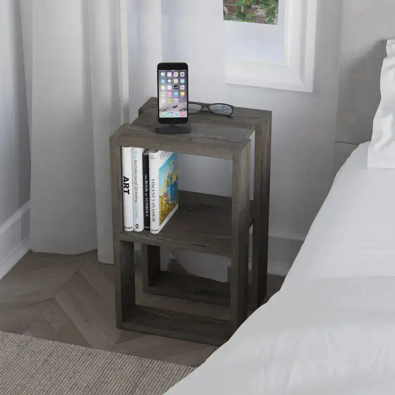 Dark brown bedside table with open cubby shelves and tabletop for a phone