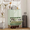 Light green shoe cabinet with open top tier and shoes stored in ridged drawer