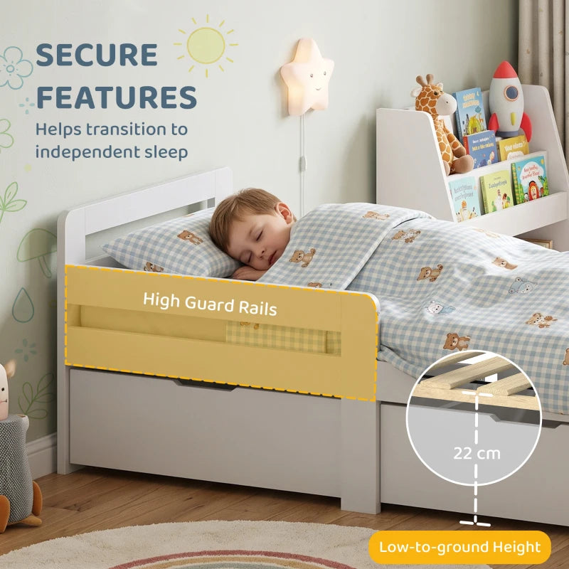 Grey kids bed frame with high guard rails and low-to-ground height, slatted base