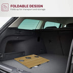 Folded bamboo-top picnic table laid flat in a car trunk cargo area