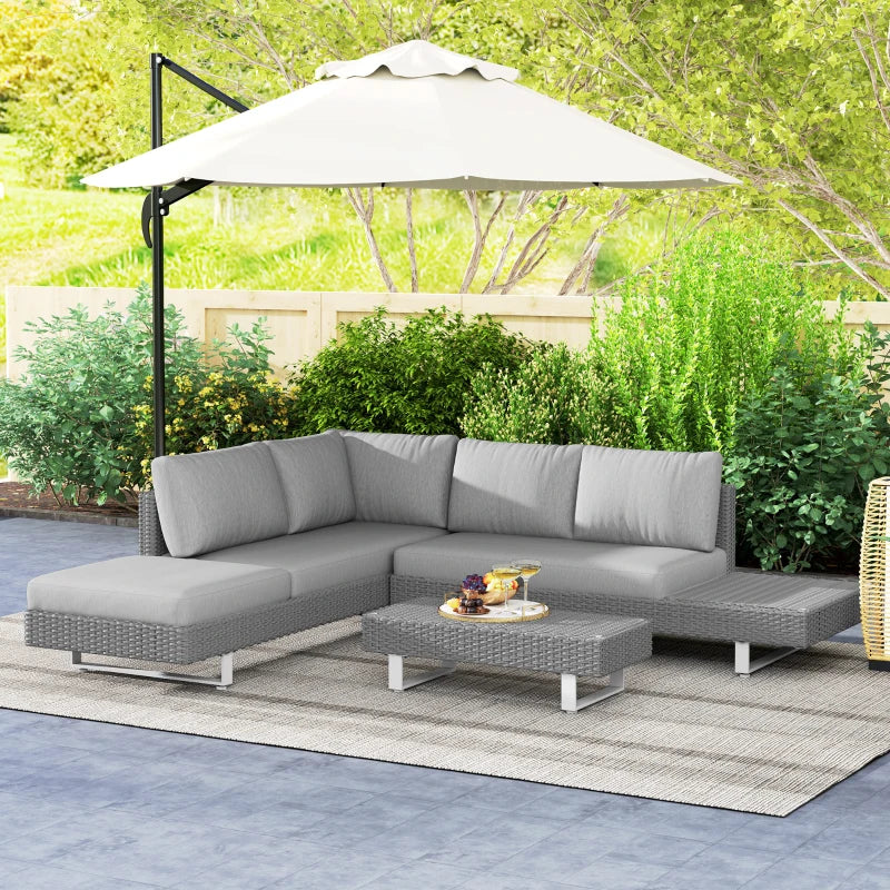 Light grey rattan sectional sofa set with cushions and woven coffee table