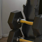 Black angled dumbbell cradle on five-tier storage rack.