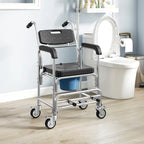 Black commode chair with padded seat, armrests, and blue bucket near toilet